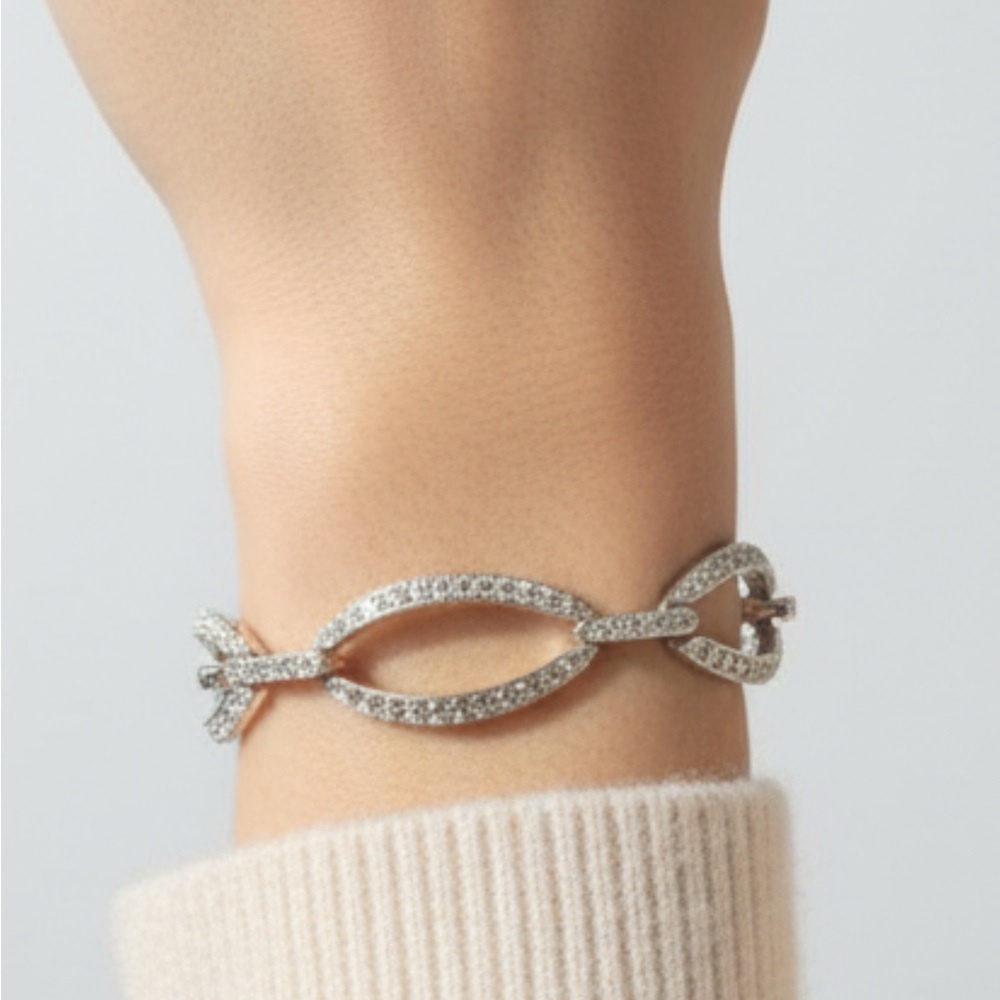 Silver tone bracelet with crystals.